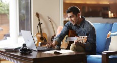 Man Playing Guitar with Inspiron 15 5000 Series Notebook