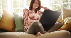Young Woman At Home Using Inspiron 15 3000 Series